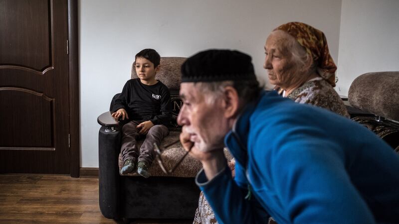 Adlan (9), a child taken to Syria by his parents and found by soldiers in the ruins of Mosul during fighting with Isis, and returned to his home country an orphan, at the home of his grandparents in Grozny, Russia. Photograph: Sergey Ponomarev/The New York Times