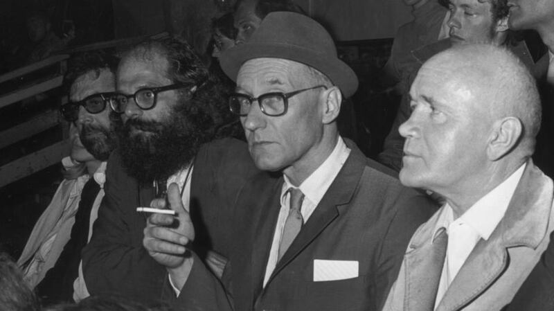 Terry Southern, left, Allen Ginsberg,  William S Burroughs (smoking) and   Jean Genet in the audience of the Democratic National Convention, Chicago, on August 28th, 1968. Photograph: Santi Visalli Inc./Getty Images