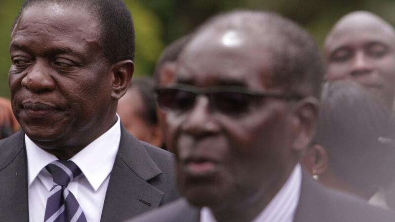 Mugabe resigns: Vice-President Emmerson Mnangagwa with the Zimbabwean president in 2014. Photograph: Tsvangirayi Mukwazhi/AP