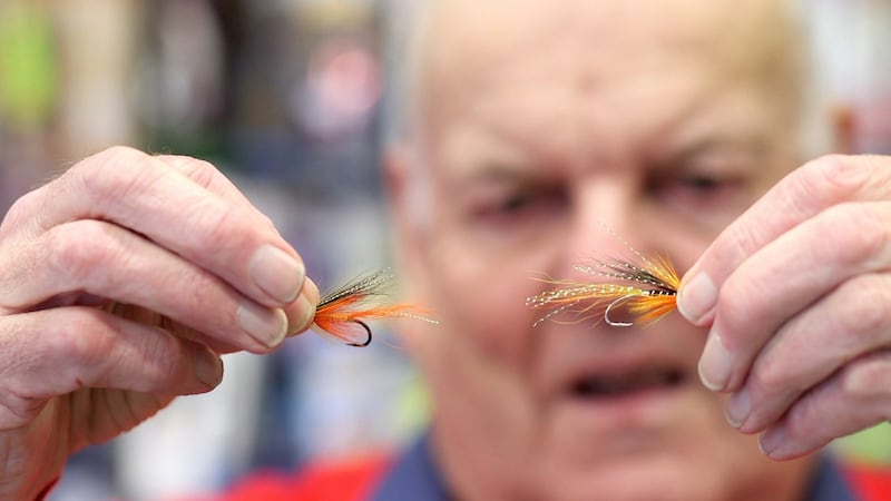 Rory Harkin examines some of his stock in his shop in Dublin’s Temple Bar. Photograph: Bryan O’Brien/The Irish Times.