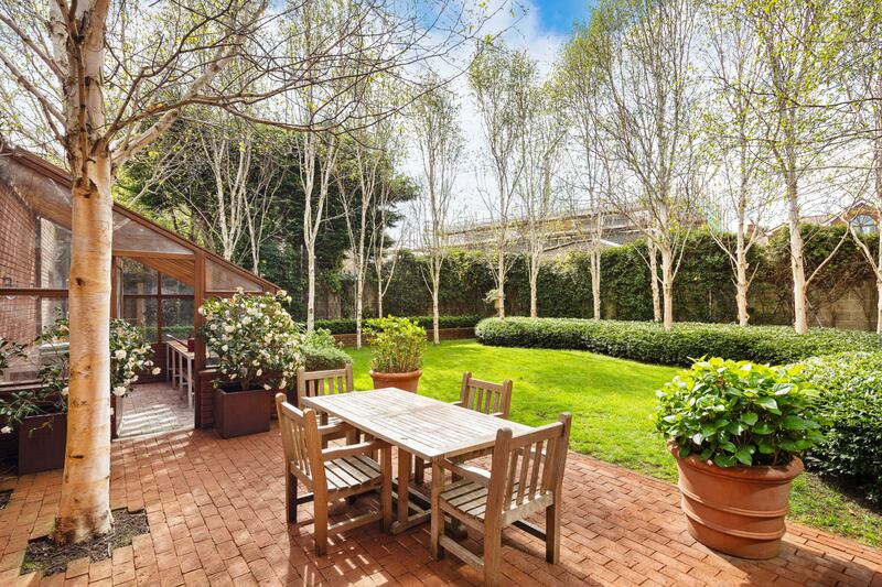Garden with brick patio and potting shed