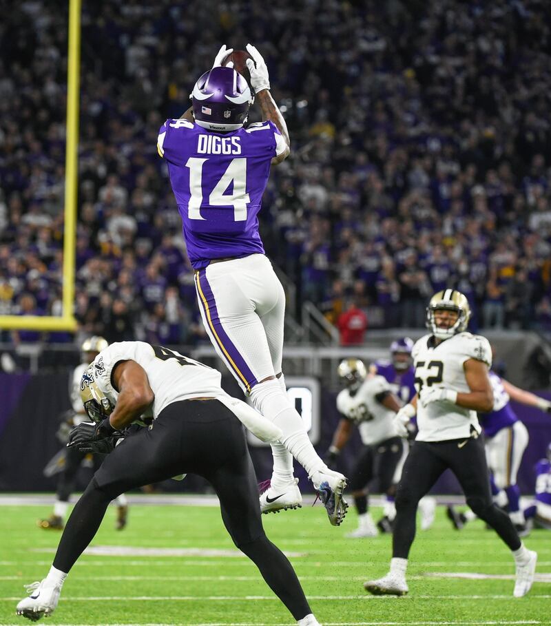 Minnesota Vikings wide receiver Stefon Diggs catches the ball ahead of New Orleans free safety Marcus Williams before scoring the game-winning touchdown. Photograph: Craig Lassig/EPA