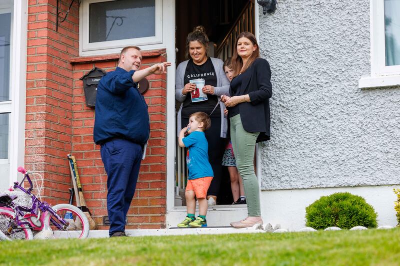 Sinn Féin's European election candidate Kathleen Funchion TD and local election candidate David Kennedy speak with Catriona Brennan and her children Tom and Molly while canvassing at Dangan Terrace in Thomastown, Co Kilkenny. Photograph: Dylan Vaughan