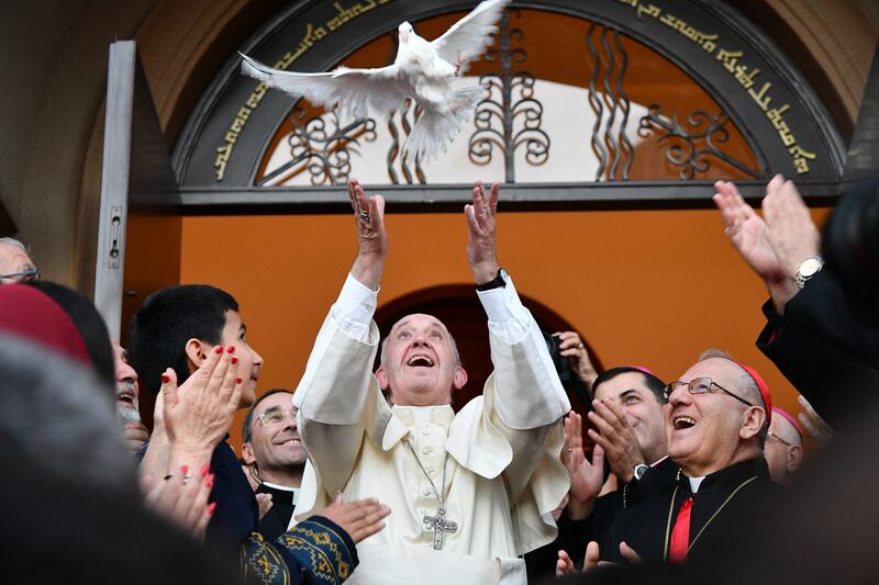 2016. Pope Francis (C) releases a dove as a symbol of peace during a meeting with Chaldean community at the Catholic Church of St Simon Bar Sabbae in Tbilisi, on September 30, 2016. Photograph: Vincenzo Pinto/AFP via Getty Images