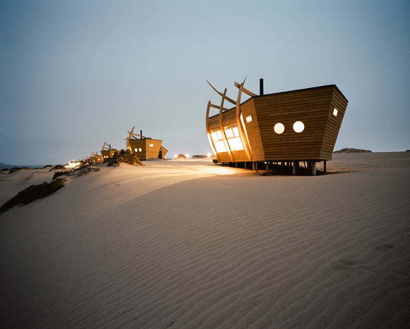 Shipwreck Lodge in Namibia: stay in shipwreck-shaped cabins with a view of the Atlantic ocean, hidden between the sand dunes of Skeleton Coast National Park, the perfect base for activities such as sandboarding and quad biking
