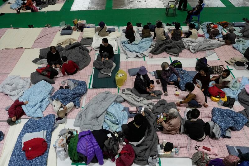 Escaped villagers from the wildfires take rest at a shelter in Yeongyang. Photograph: Ahn Young-joon/AP