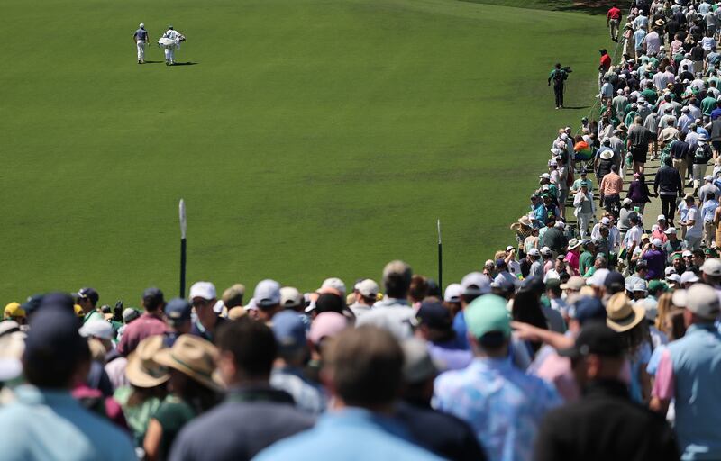 Rory McIlroy walks down the first fairway on his way to a horrible double bogey start. Photograph: Michael Reaves/Getty Images