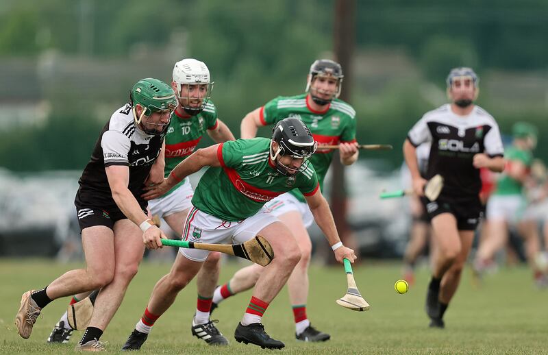 JK Brackens' Éanna McBride and Tómas McGrath of Loughmore-Castleiney. Photograph: Bryan Keane/Inpho