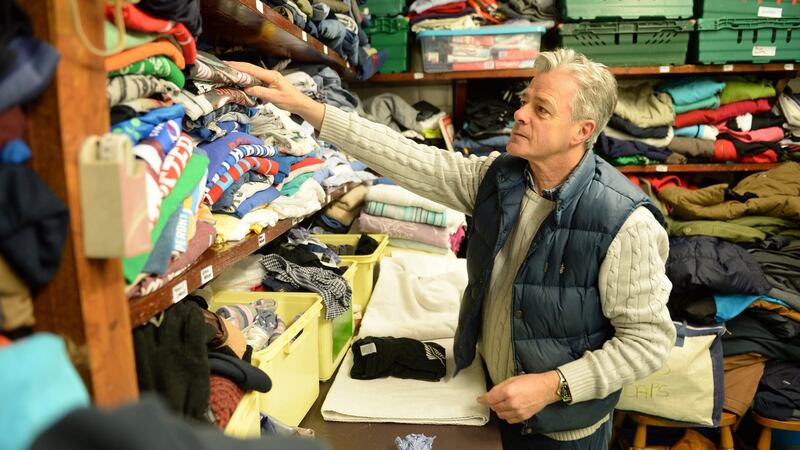 Matthew Geoghegan sorting clothes at the Alice Leahy Trust. Photograph: Dara Mac Dónaill