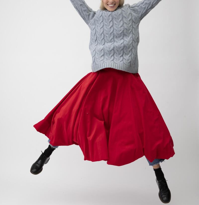 Paper bag skirt in red needlecord £275 with long blue cable knit, £230, cabbagesandroses.com