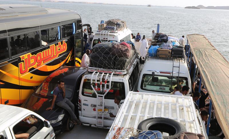 People sail on a Nile River ferry towards Egypt after crossing the border from Sudan. Photograp: Khaled Elfiqi