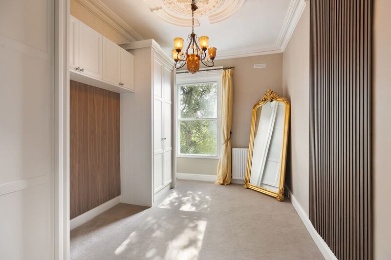 Bedroom with Murphy bed and walnut panelling