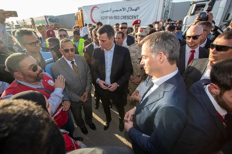 Spain's prime minister Pedro Sánchez and his Belgian counterpart Alexander De Croo meet Red Cross workers at the Rafah border crossing between Egypt and Gaza on Friday. Photograph: Nicolas Maeterlinck/Belga Mag/AFP via Getty Images