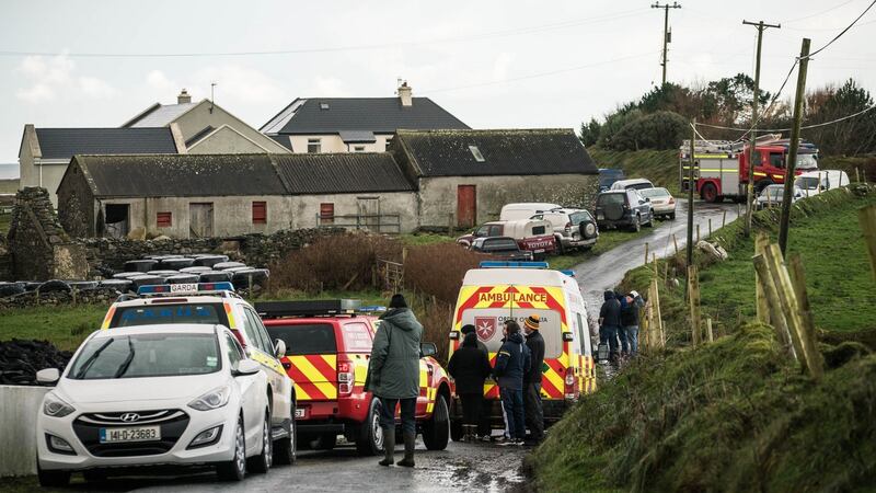 Locals gather at Carrowniskey, Louisburgh, Co Mayo where  two men were killed after their vehicle entered the water. Photograph: Keith Heneghan