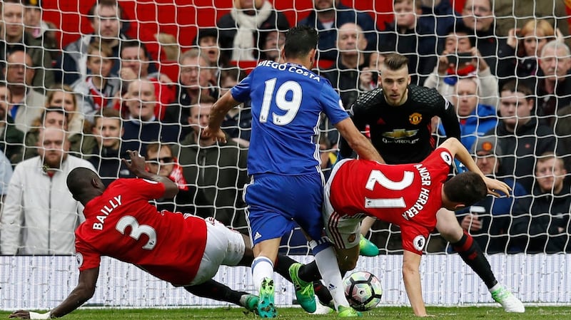 Bailyl and Hererra combine to deny Costa from close range. Photo: Phil Noble/Reuters