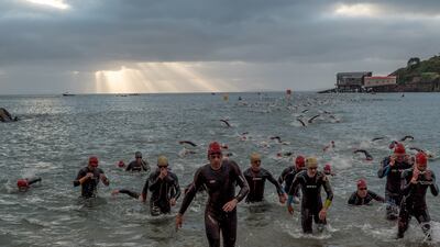 Competitors reach the halfway point of the swimming portion of the Wales Ironman in Tenby.