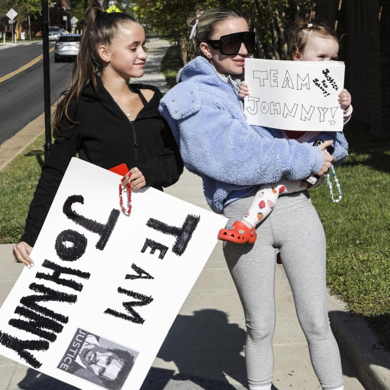 Sisters Esther Gunn and Margaret Gunn wait near the security entrance outside the courthouse for a chance to see actor Johnny Depp. Photograph: Valerie Plesch/The New York Times