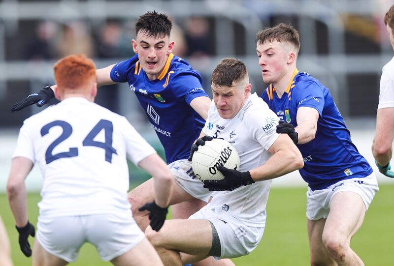 Kildare's Jack Sargent is tackled by Cillian McDonald and John Paul Nolan of Wicklow at O'Moore Park in Co Laois on Sunday. Photograph: Tom Maher/Inpho