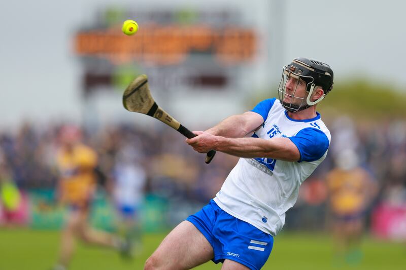 Patrick Curran sends the sliotar upfield during Waterford's defeat of Clare last weekend. Natasha Barton/Inpho
