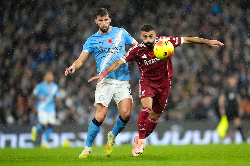 Ruben Dias and Mohamed Salah battle for the ball on Sunday. Photograph: Nick Potts/PA