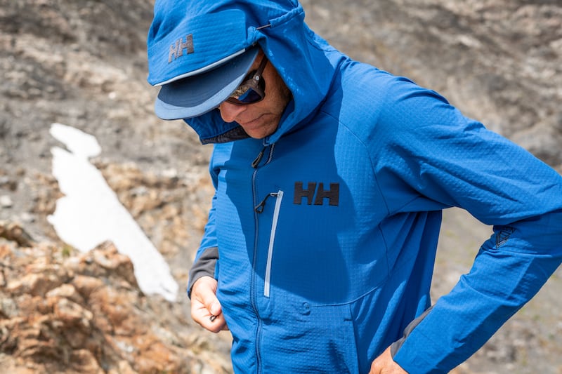 When choosing an outer layer, look for features like zip placement that isn’t impeded by backpack straps, a fabric that has good breathability for summer hiking, and a hood that is adjustable to fit over a hat or helmet 