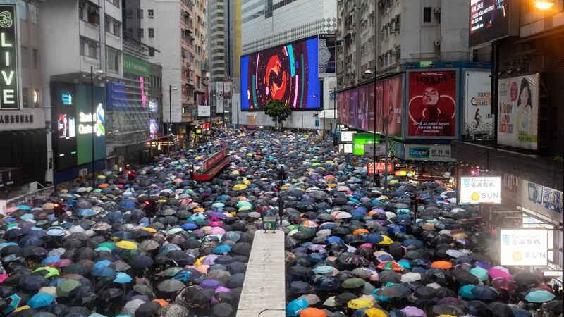 Demonstrators march during a protest in the Causeway Bay district of Hong Kong on Sunday. Photograph: Kyle Lam/Bloomberg.