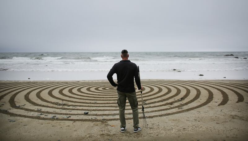 'The biggest enemy is crazy little dogs who go wild playing with a ball. They could destroy a drawing in a minute. But I don’t own the beach.'  Photograph: Bryan O’Brien 