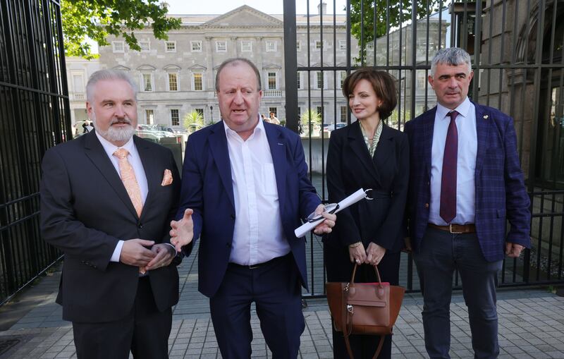 Left to right: Cork North-Central TD Kenneth O'Flynn, Independent Ireland leader Michael Collins, Maria Steen and Limerick TD Richard O'Donoghue at Leinster House on Tuesday. Photograph: Alan Betson/The Irish Times