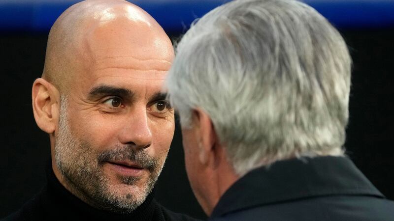 Manchester City’s  Pep Guardiola speaks with  Carlo Ancelotti. Photograph: Manu Fernandez/AP Photo