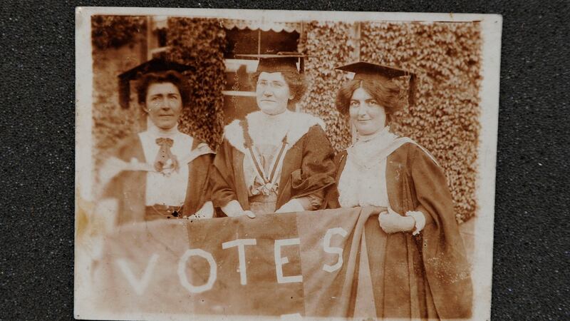 From left - Hanna Sheehy-Skeffington, Kathleen Shannon and Kate Sheedy, in their graduation robes and mortar-boards, carrying a banner saying “Votes” (for women)