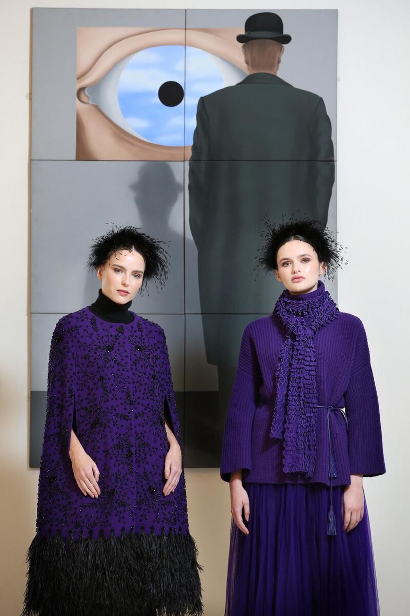 Hand embellished wool crepe cape with floral beadwork and feathers and  lambswool knit sweater (right) Photograph: Louise Kennedy