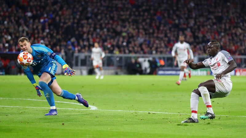 Mané chips past Neuer to put Liverpool 1-0 up. Photo: Lars Baron/Bongarts/Getty Images