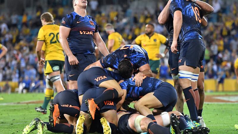 Argentina celebrate victory over the Wallabies. Photograph: Dave Hunt/Reuters