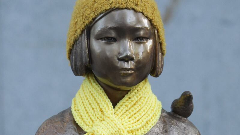 A statue of a girl symbolising  “comfort women” in Seoul. Photograph: Getty Images