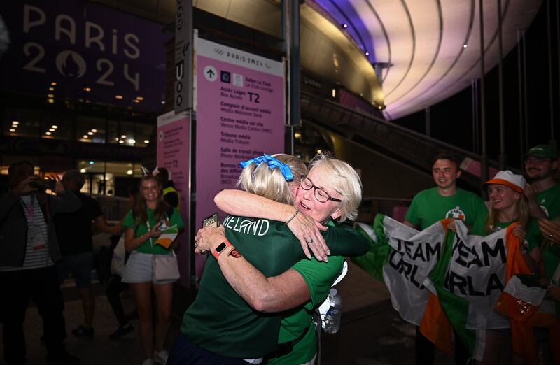Bronze medallist Orla Comerford of Ireland is greeted by her mother Siobhán after her women's T13 100m final on day six of the Paris 2024 Paralympic Games at Stade de France in Paris, France. Photograph: Harry Murphy/Sportsfile