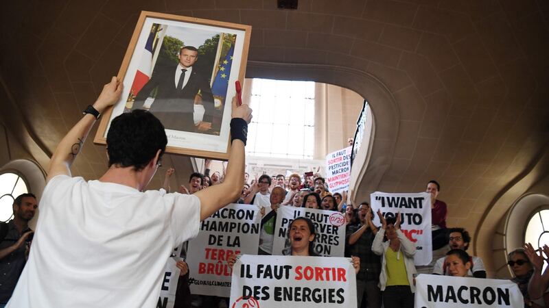 Protestors call on the French government to take action on climate change. Photograph: Alain Jocard/AFP/Getty Images