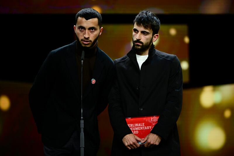 Palestinian director Basel Adra  and Israeli director Yuval Abraham speak on stage after having received the Berlinale documentary award for No Other Land on February 24th during the Berlin Film Festival. Photograph: John Macdougall/AFP via Getty Images