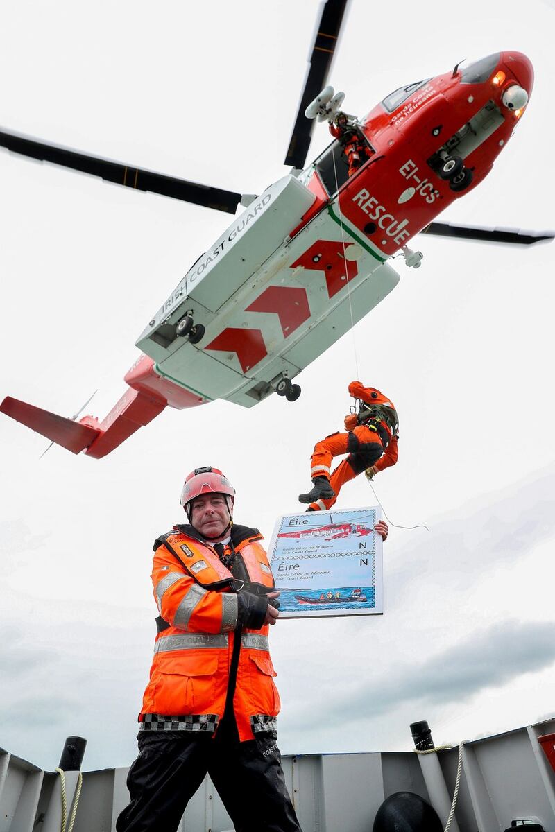 Kyron O’Gorman with Sean Jennings, winchman, at sea for the launch of new stamp. Photograph: maxwellphotography.ie