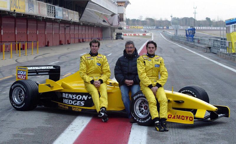 Eddie Jordan with drivers Ralph Firman Jnr (left) and Giancarlo Fisichella (right) during testing at Barcelona's Circuit de Catalunya in February 2003. Photograph: Inpho/Getty Images