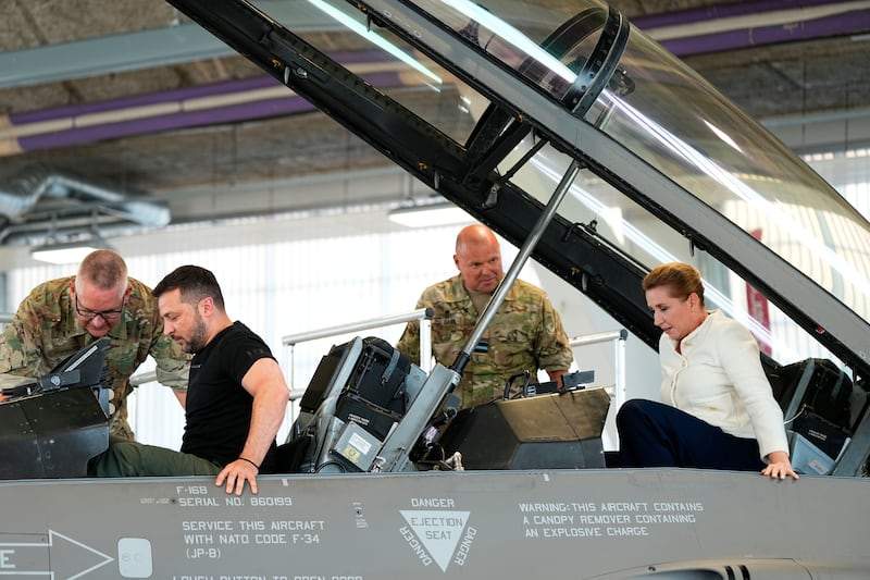 Ukrainian president Volodymyr Zelenskiy and Denmark's prime minister Mette Frederiksen sit in an F-16 fighter jet at Skrydstrup Airbase in Vojens, Denmark, in August last year. Photograph: Mads Claus Rasmussen/EPA
