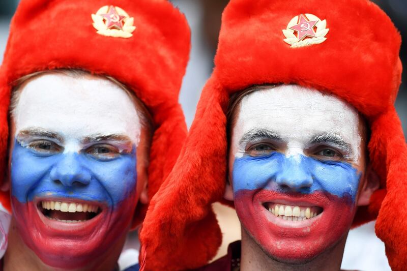 Russia fans smile before the start of the Russia 2018 FIFA World Cup PATRIK STOLLARZ/AFP/Getty Images