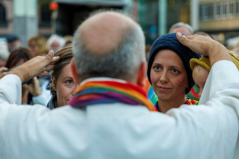 Catholic priests give blessings to same-sex couples during a protest outside Cologne Cathedral, in Cologne, Germany in September 2023. Photograph: Christopher Neundorf/Shutterstock