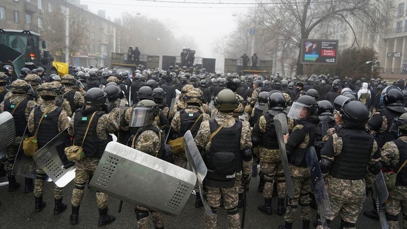 Riot police block a street in Almaty, Kazakhstan. Photograph: Vladimir Tretyakov/AP