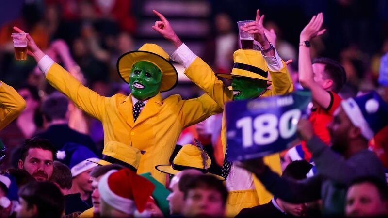 Darts fans cheer a 180 during day nine of the l World Darts Championships at Alexandra Palace, London.  Photograph:  John Walton/PA