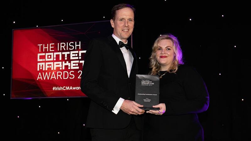 Fionnuala Tohill, Awards Judge presents the Outstanding Contribution Award to John Collins, Intercom.