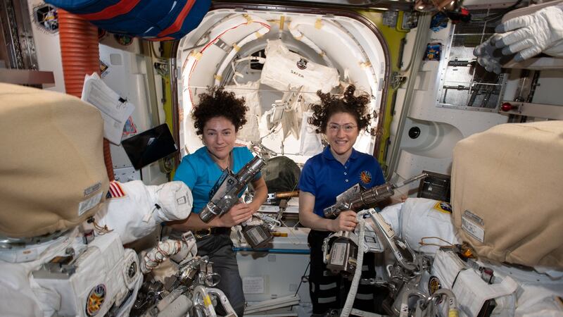 NASA astronauts Jessica Meir (L) and Christina Koch inside the Quest airlock preparing the US spacesuits and tools they will use on their first spacewalk together. Photograph: EPA/NASA HANDOUT /JOHNSON SPACE CENTER