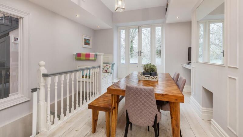 The stairs from the dining room makes the living room very accessible.