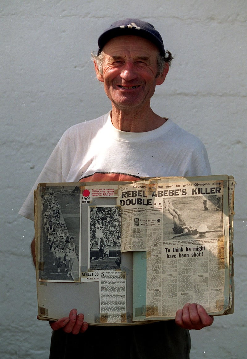 Jim Hogan displays newspaper cuttings from the Tokyo Olympics. Photograph: Tom Honan/Inpho