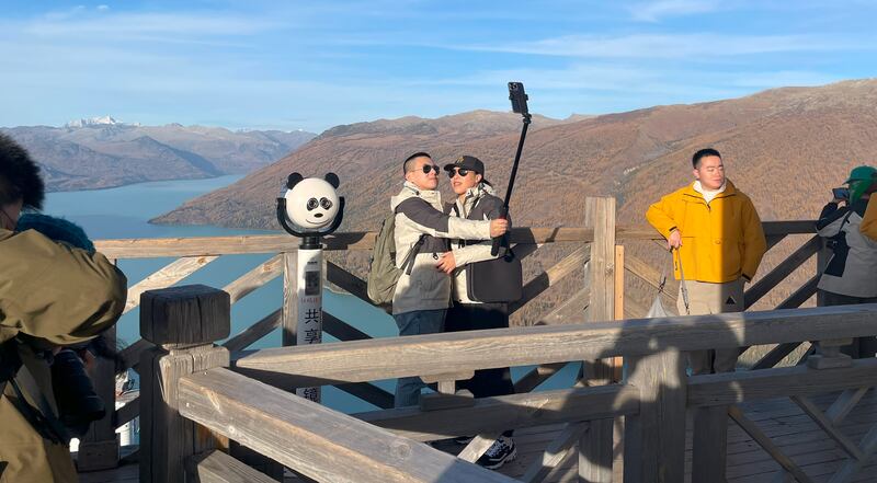 Tourists taking selfies in Kanas, Xinjiang province. Photograph: Denis Staunton