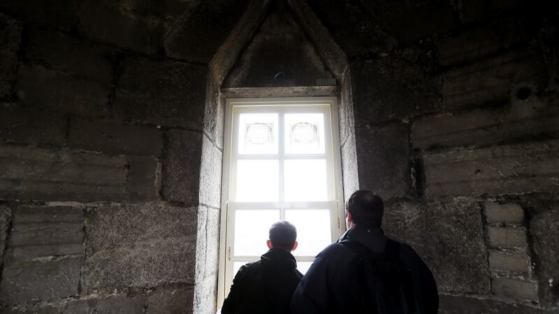 People look out one of the windows at the top of the tower during the reopening of the O’Connell Tower. Photograph: Brian Lawless/PA Wire